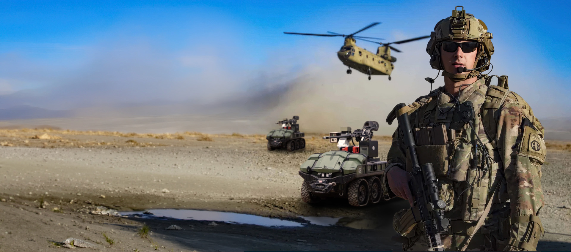 Army soldier standing infront of of HDT Robotics Hunter WOLF: Army GOAT, SMET